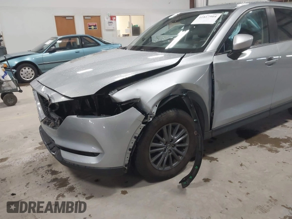 2020 Mazda CX-5 Touring with VIN JM3KFBCMXL0784653, listed as a IAAI auction lot 41817904 with 71,513 mi miles and . Bid and sale history available at carsss.com. Image 6.