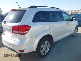 2012 Dodge Journey SXT z VIN 3C4PDCBG7CT374496, wystawiony jako IAAI lot #42317000 z przebiegiem 149 029 mil mil oraz . Historia ofert i sprzedaży dostępna na DreamBid. Obrazek 4.