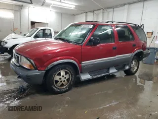 1999 GMC Jimmy SLE with VIN 1GKDT13W3X2535602, listed as a Copart auction lot 83250924 with 203,134 mi miles and Salvage Title. Bid and sale history available at carsss.com. Image 1.