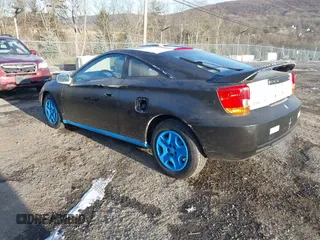 2000 Toyota Celica GT with VIN JTDDR32TXY0061397, listed as a IAAI auction lot 41264249 with 256,280 mi miles. Bid and sale history available at carsss.com. Image 3.