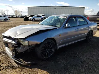 1999 Nissan Skyline z VIN HR34005885, wystawiony jako Copart lot #75422984 z przebiegiem 150 776 mil mil oraz Szkoda całkowita • Salvage title. Historia ofert i sprzedaży dostępna na DreamBid. Obrazek 1.