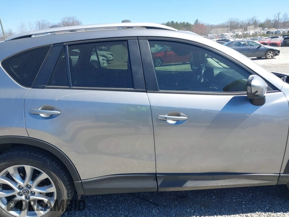 2014 Mazda CX-5 Grand Touring with VIN JM3KE4DY3E0368169, listed as a IAAI auction lot 41857976 with 127,853 mi miles. Bid and sale history available at carsss.com. Image 13.
