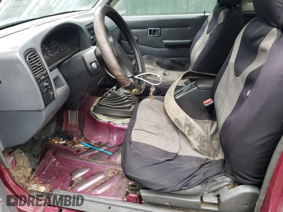 1995 Nissan Frontier SE z VIN 1N6HD16Y1SC324955, wystawiony jako Copart lot #42983295 z przebiegiem 266 320 mil mil oraz Szkoda całkowita • Salvage title. Historia ofert i sprzedaży dostępna na DreamBid. Obrazek 7.