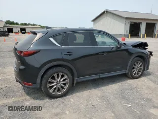 2019 Mazda CX-5 Grand Touring with VIN JM3KFBDM2K0569829, listed as a Copart auction lot 59060965 with 99,359 mi miles and Salvage title. Bid and sale history available at DreamBid. Image 3.