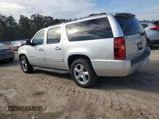 2014 Chevrolet Suburban LTZ with VIN 1GNSCKE02ER141764, listed as a Copart auction lot 85005524 with 234,019 mi miles and Salvage title. Bid and sale history available at DreamBid. Image 2.