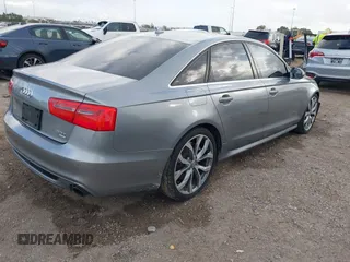 2013 Audi A6 3.0T Prestige with VIN WAUHGAFC3DN131239, listed as a IAAI auction lot 41168869 with 134,628 mi miles. Bid and sale history available at carsss.com. Image 4.