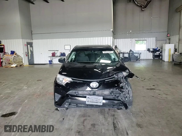 2018 Toyota RAV4 LE with VIN 2T3BFREV6JW763007, listed as a Copart auction lot 58604545 with 107,683 mi miles and Salvage title. Bid and sale history available at DreamBid. Image 14.