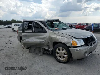 2002 GMC Envoy SLT with VIN 1GKDT13SX22380133, listed as a Copart auction lot 69816144 with 90,060 mi miles and Salvage Title. Bid and sale history available at DreamBid. Image 4.