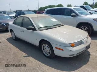 2002 Saturn SL z VIN 1G8ZK52772Z218812, wystawiony jako IAAI lot #42763871 z przebiegiem 86 338 mil mil oraz . Historia ofert i sprzedaży dostępna na DreamBid. Obrazek 1.