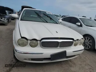 2004 Jaguar XJ with VIN SAJWA71C44SG34094, listed as a Copart auction lot 74969004 with 0 mi miles and Salvage Title. Bid and sale history available at carsss.com. Image 5.