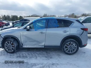 2021 Mazda CX-5 Grand Touring Reserve with VIN JM3KFBAY0M0377030, listed as a IAAI auction lot 41606709 with 39,590 mi miles. Bid and sale history available at carsss.com. Image 14.