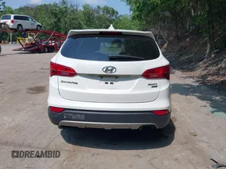 2015 Hyundai Santa Fe z VIN 5XYZTDLB3FG298677, wystawiony jako IAAI lot #42436155 z przebiegiem 118 181 mil mil oraz . Historia ofert i sprzedaży dostępna na DreamBid. Obrazek 16.