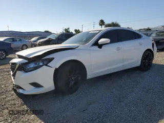 2014 Mazda 6 i Touring with VIN JM1GJ1V69E1126812, listed as a Copart auction lot 62880525 with 124,338 mi miles and Salvage title. Bid and sale history available at DreamBid. Image 1.