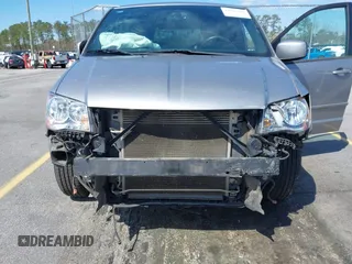 2014 Dodge Grand Caravan SXT with VIN 2C4RDGCGXER261467, listed as a IAAI auction lot 41801810 with 97,322 mi miles and . Bid and sale history available at DreamBid. Image 6.