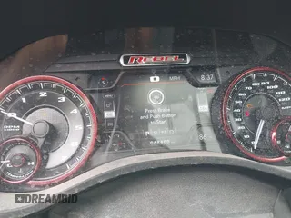 2019 Ram 1500 Rebel z VIN 1C6SRFLT5KN923837, wystawiony jako IAAI lot #41961921 z przebiegiem 68 400 mil mil oraz . Historia ofert i sprzedaży dostępna na DreamBid. Obrazek 7.