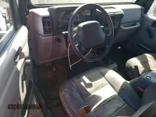 1998 Jeep Wrangler Sport with VIN 1J4FY19S2WP790179, listed as a Copart auction lot 69853294 with 148,675 mi miles and Salvage Title. Bid and sale history available at carsss.com. Image 8.
