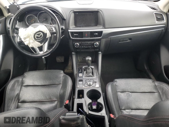 2016 Mazda CX-5 Grand Touring z VIN JM3KE4DY2G0637779, wystawiony jako Copart lot #52001805 z przebiegiem 184 381 mil mil oraz Czysty tytuł • Clean title. Historia ofert i sprzedaży dostępna na DreamBid. Obrazek 8.