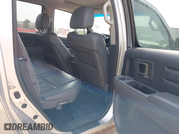 2007 Honda Ridgeline RTL z VIN 2HJYK16517H530890, wystawiony jako IAAI lot #42521976 z przebiegiem 285 222 mil mil oraz . Historia ofert i sprzedaży dostępna na DreamBid. Obrazek 8.