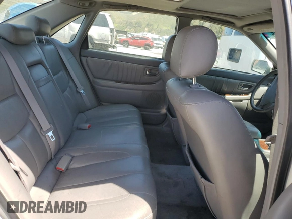2001 Toyota Avalon XL z VIN 4T1BF28B11U154831, wystawiony jako Copart lot #57131435 z przebiegiem 211 745 mil mil oraz Szkody całkowita. Historia ofert i sprzedaży dostępna na DreamBid. Obrazek 10.