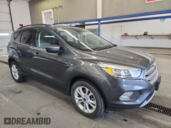 2018 Ford Escape SE z VIN 1FMCU9GD0JUC61682, wystawiony jako Copart lot #59105625 z przebiegiem 85 146 mil mil oraz Czysty tytuł • Clean title. Historia ofert i sprzedaży dostępna na DreamBid. Obrazek 4.
