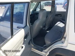 1996 Jeep Cherokee SE with VIN 1J4FT28S7TL307603, listed as a IAAI auction lot 42087278 with 141,994 mi miles. Bid and sale history available at carsss.com. Image 8.
