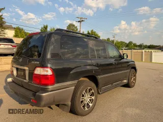 2004 Lexus LX 470 with VIN JTJHT00W44354386, listed as a Copart auction lot 63816455 with 389,442 mi miles and Clean title. Bid and sale history available at DreamBid. Image 4.