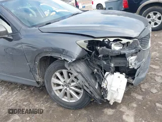 2015 Mazda CX-5 Touring with VIN JM3KE2CY2F0461935, listed as a IAAI auction lot 41430070 with 220,857 mi miles and . Bid and sale history available at carsss.com. Image 6.