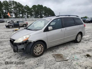 2010 Toyota Sienna XLE with VIN 5TDYK4CC1AS322395, listed as a Copart auction lot 60520215 with 148,725 mi miles and Salvage title. Bid and sale history available at DreamBid. Image 1.