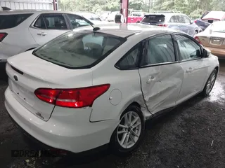 2016 Ford Focus SE с VIN 1FADP3F22GL211156, выставлен на аукционе IAAI как лот 42502613 с пробегом 121 224 миль миль и . История ставок и продаж доступна на DreamBid. Изображение 4.