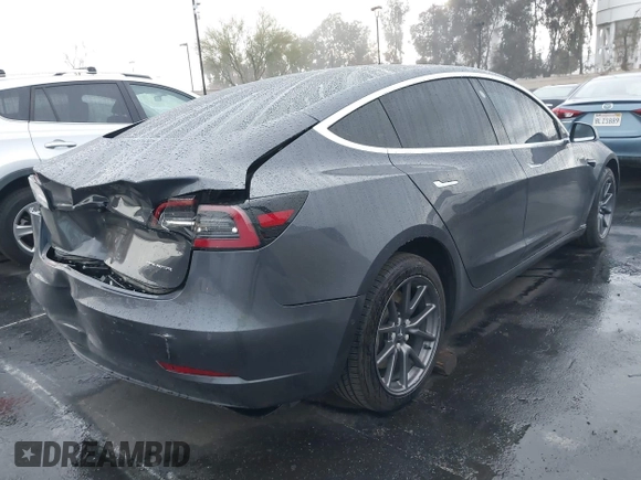 2018 Tesla Model 3 Long Range Battery with VIN 5YJ3E1EB1JF149423, listed as a IAAI auction lot 41896090 with 158,787 mi miles and . Bid and sale history available at DreamBid. Image 4.