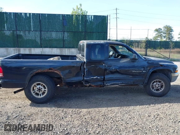 1999 Dodge Dakota SLT with VIN 1B7GG22X8XS115282, listed as a IAAI auction lot 42136576 with 220,465 mi miles and . Bid and sale history available at carsss.com. Image 13.
