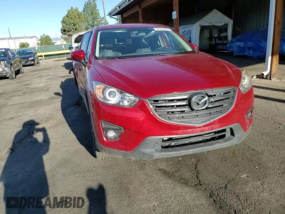 2016 Mazda CX-5 Grand Touring z VIN JM3KE4DY9G0753691, wystawiony jako Copart lot #57361645 z przebiegiem 90 733 mil mil oraz Szkoda całkowita • Salvage title. Historia ofert i sprzedaży dostępna na DreamBid. Obrazek 12.