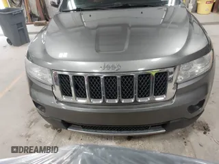 2013 Jeep Grand Cherokee Overland with VIN 1C4RJFCT9DC524605, listed as a IAAI auction lot 42016103 with 215,352 mi miles. Bid and sale history available at carsss.com. Image 12.
