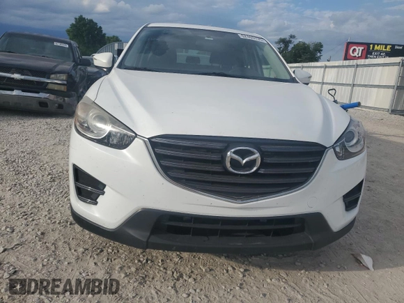 2016 Mazda CX-5 Sport with VIN JM3KE2BY0G0729349, listed as a Copart auction lot 62469735 with 88,247 mi miles and Salvage title. Bid and sale history available at DreamBid. Image 5.