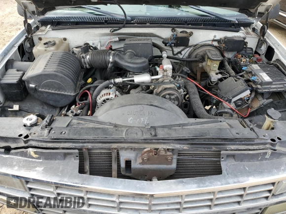 1999 Chevrolet Suburban with VIN 1GNEC16R7XJ418169, listed as a Copart auction lot 88995495 with 2,015,240 mi miles and Salvage title. Bid and sale history available at DreamBid. Image 12.