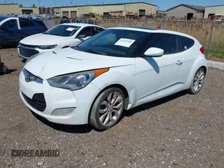 2013 Hyundai Veloster w/Gray Int with VIN KMHTC6AD1DU165476, listed as a IAAI auction lot 42242540 with 201,732 mi miles and . Bid and sale history available at DreamBid. Image 2.