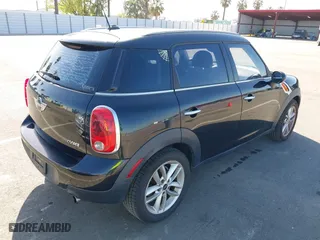 2013 MINI Cooper Countryman with VIN WMWZB3C52DWM07621, listed as a IAAI auction lot 42085389 with 153,714 mi miles. Bid and sale history available at carsss.com. Image 4.