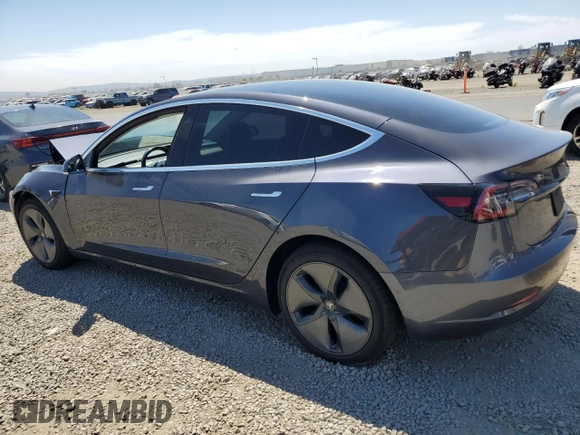 2019 Tesla Model 3 Mid Range with VIN 5YJ3E1EA2KF416304, listed as a Copart auction lot 52792845 with 140,552 mi miles and Salvage Title. Bid and sale history available at DreamBid. Image 2.