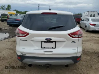 2014 Ford Escape SE z VIN 1FMCU9G96EUD93590, wystawiony jako Copart lot #57810015 z przebiegiem 146 919 mil mil oraz Czysty tytuł • Clean title. Historia ofert i sprzedaży dostępna na DreamBid. Obrazek 6.