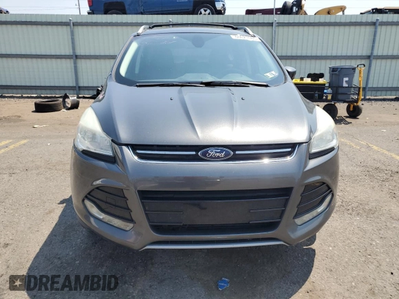 2015 Ford Escape Titanium z VIN 1FMCU9J97FUA38731, wystawiony jako Copart lot #60621085 z przebiegiem 119 704 mil mil oraz Szkoda całkowita • Salvage title. Historia ofert i sprzedaży dostępna na DreamBid. Obrazek 5.