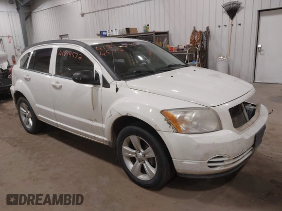 2010 Dodge Caliber SXT with VIN 1B3CB4HA3AD590654, listed as a IAAI auction lot 41814572 with 203,422 mi miles and . Bid and sale history available at DreamBid. Image 1.