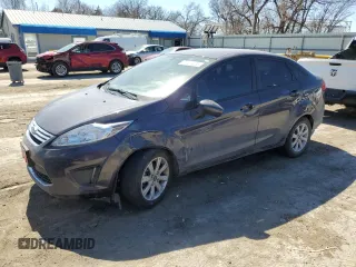 2012 Ford Fiesta SE with VIN 3FADP4BJXCM150649, listed as a Copart auction lot 48501235 with 64,559 mi miles and Salvage Title. Bid and sale history available at carsss.com. Image 1.