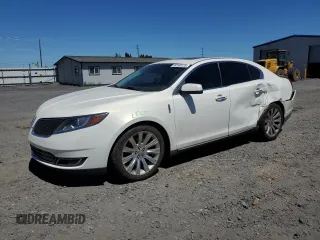 2013 Lincoln MKS z VIN 1LNHL9EK8DG610553, wystawiony jako Copart lot #59160125 z przebiegiem 128 846 mil mil oraz Szkoda całkowita • Salvage title. Historia ofert i sprzedaży dostępna na DreamBid. Obrazek 1.