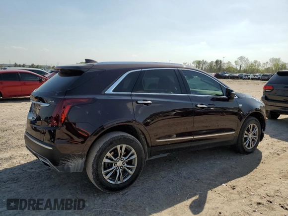 2021 Cadillac XT5 FWD Premium Luxury with VIN 1GYKNCRS2MZ180884, listed as a Copart auction lot 50433445 with 27,246 mi miles and Salvage Title. Bid and sale history available at carsss.com. Image 3.