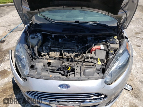 2017 Ford Fiesta S z VIN 3FADP4AJ7HM162072, wystawiony jako Copart lot #58760304 z przebiegiem 122 751 mil mil oraz Szkoda całkowita • Salvage title. Historia ofert i sprzedaży dostępna na DreamBid. Obrazek 11.