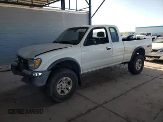1999 Toyota Tacoma z VIN 4TAWN72NXXZ489764, wystawiony jako Copart lot #52731405 z przebiegiem 235 908 mil mil oraz Szkoda całkowita • Salvage title. Historia ofert i sprzedaży dostępna na DreamBid. Obrazek 1.