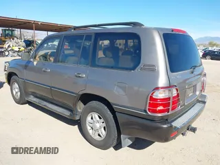 2000 Lexus LX 470 with VIN JT6HT00WXY0079873, listed as a IAAI auction lot 41605770 with 302,758 mi miles and . Bid and sale history available at DreamBid. Image 3.