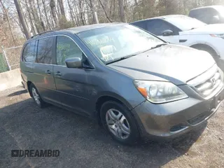 2007 Honda Odyssey EX-L z VIN 5FNRL38717B070328, wystawiony jako IAAI lot #41696829 z przebiegiem 171 229 mil mil oraz . Historia ofert i sprzedaży dostępna na DreamBid. Obrazek 1.