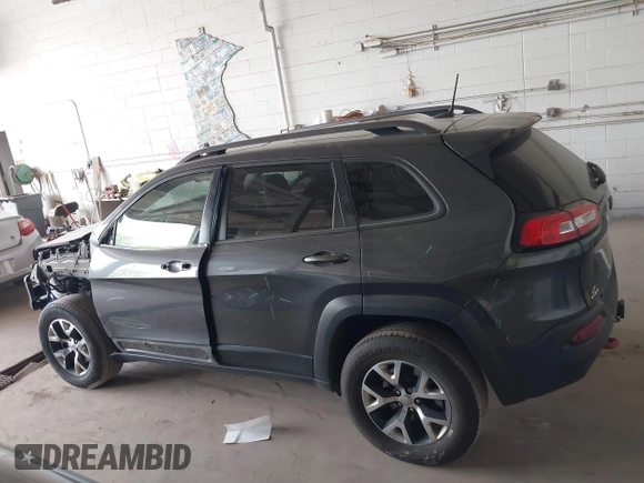 2016 Jeep Cherokee Trailhawk with VIN 1C4PJMBS0GW169184, listed as a IAAI auction lot 42255346 with 152,802 mi miles and . Bid and sale history available at DreamBid. Image 14.