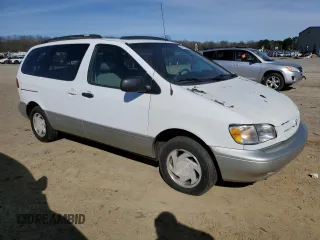 1999 Toyota Sienna LE with VIN 4T3ZF13C0XU144476, listed as a Copart auction lot 48185235 with 183,940 mi miles and Salvage title. Bid and sale history available at DreamBid. Image 4.